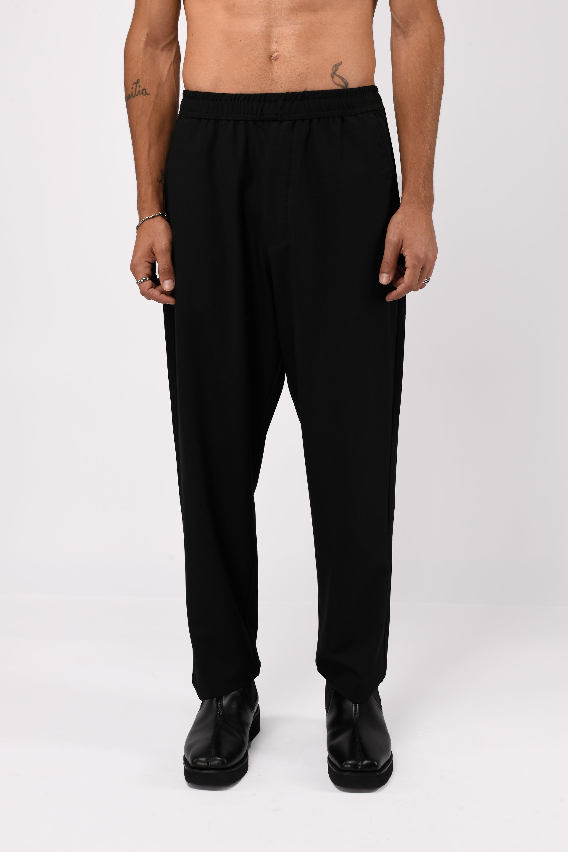 SUPREME FLOW RELAXED TROUSERS