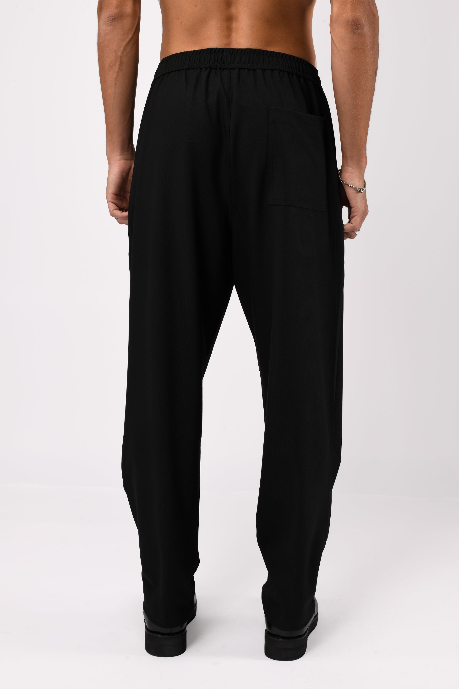 SUPREME FLOW RELAXED TROUSERS