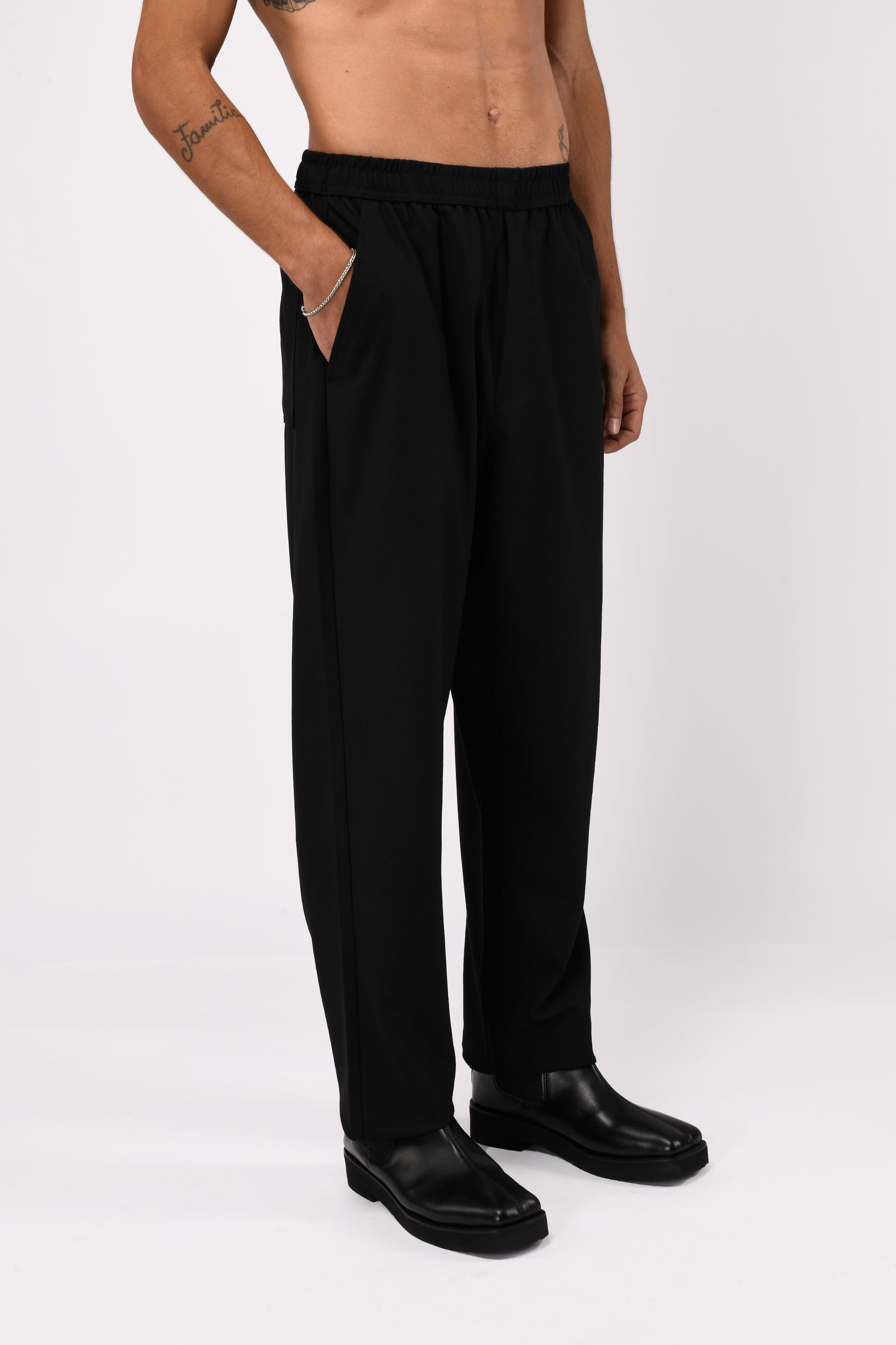 SUPREME FLOW RELAXED TROUSERS