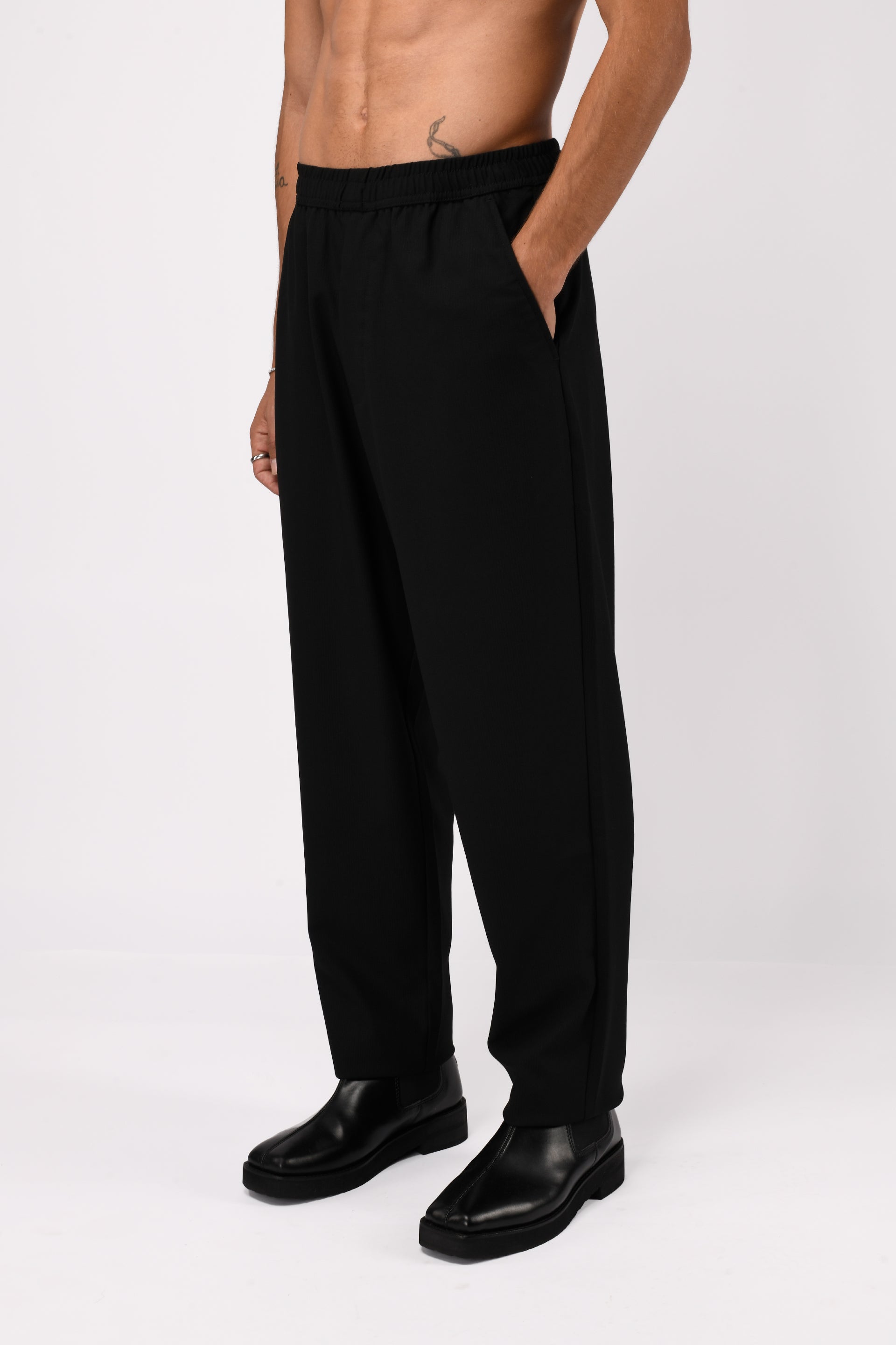 SUPREME FLOW RELAXED TROUSERS