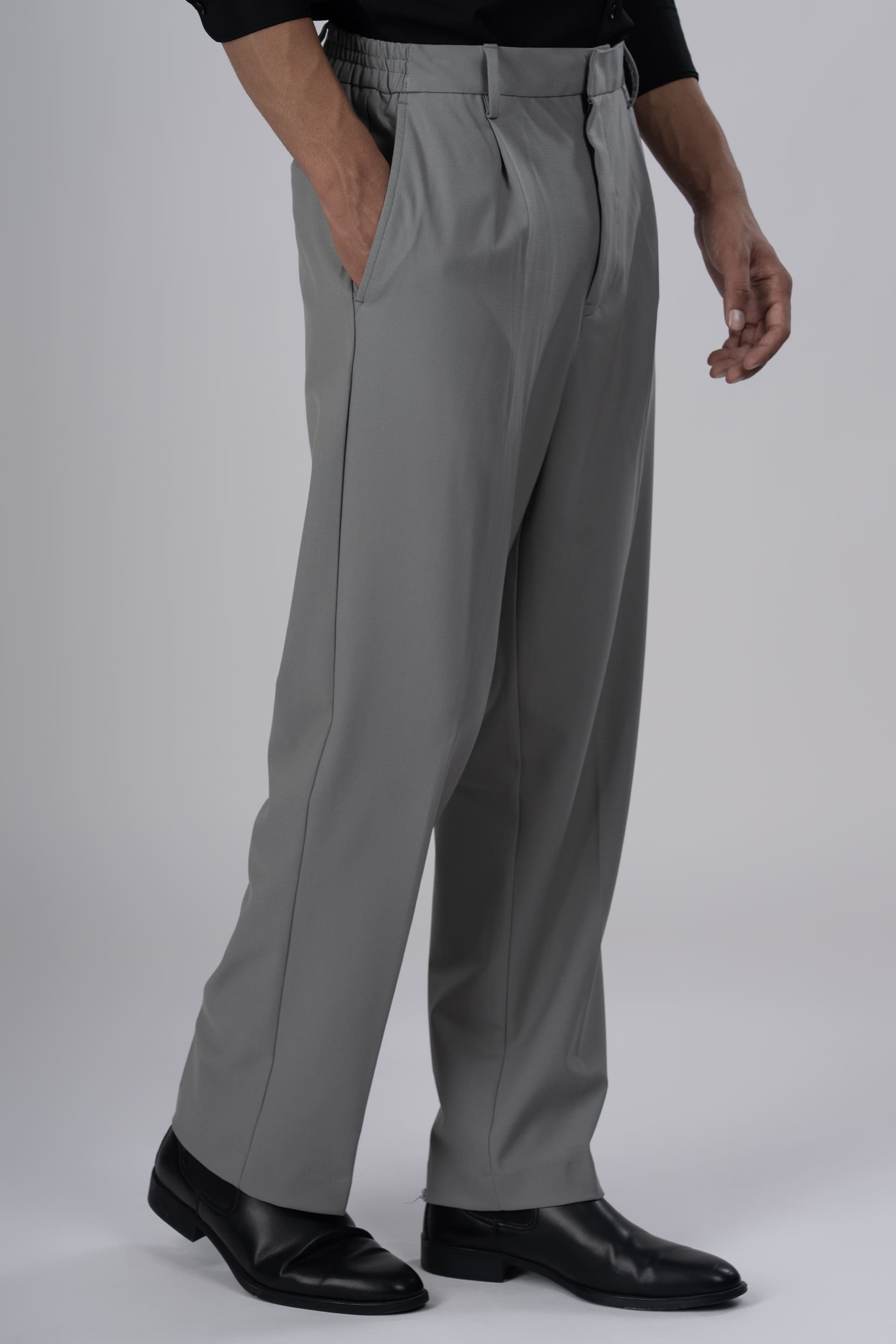 Tailoraedge Easy Iron Relaxed Pleated Trousers In Grey, Left angle image of the Trousers.